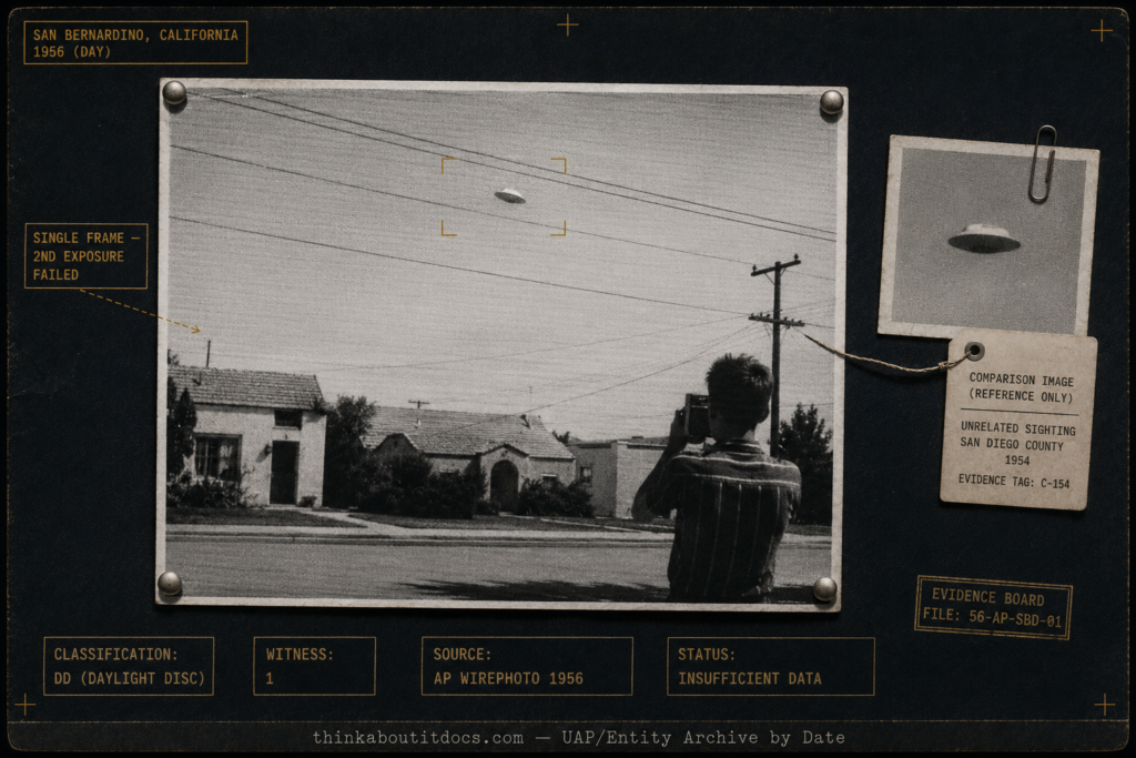 Intelligence-dossier evidence board showing the 1956 Michael Savage San Bernardino UFO wirephoto — a light-toned disc near residential power lines rendered as a high-contrast 1950s AP halftone print, with a teenage photographer in shadow and tactical HUD stamps marking the case as a single-frame Daylight Disc of insufficient data.