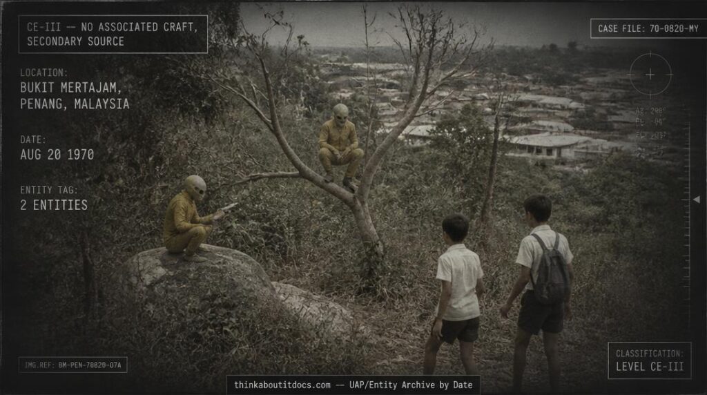 Two tiny humanoid figures in yellow suits hiding among bushes near Bukit Mertajam, Penang, Malaysia, August 1970