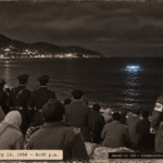 1950s-style illustration of townspeople, Korean police and a U.S. MP on the shore at Pusan, Korea watching a blue-gray glowing object float on the sea on January 15, 1956.