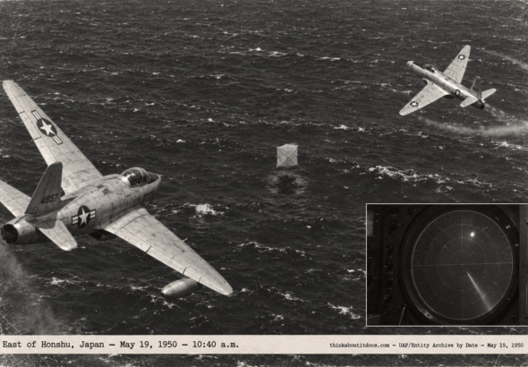 1950-style photo of two F-80 jets circling a small box-kite-shaped object over the Pacific east of Honshu, Japan
