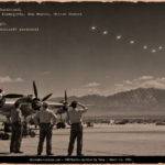 Bell Aircraft technicians at a Holloman hardstand watching a swarm of white bodies form a V over the desert, March 1951.