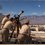 Officers at a transit telescope on the Kirtland AFB radar site roof watching a silver object in the western sky in 1952.