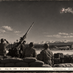 1950-style photo of soldiers at an anti-aircraft gun pit watching a red object with two white dots at Ladd AFB, Alaska