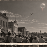 1950-style photo of townspeople pointing at a silver sphere over Poplar Bluff while an F-51 Mustang climbs toward it