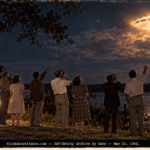 Seven people watching a large glowing object with dark panels over Walnut Lake, Michigan at night in 1952.